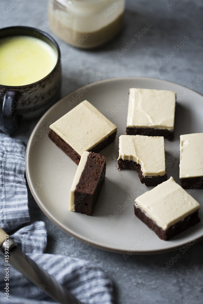 A tahini frosting on top of gluten free chocolate brownies A tahini frosting on top of gluten free chocolate brownies