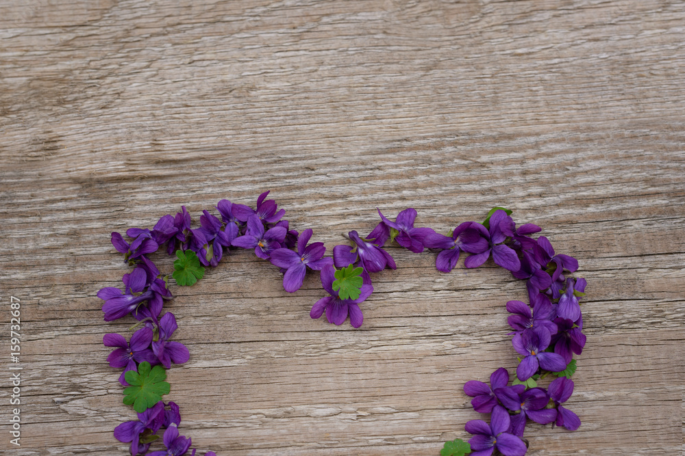 Creative layout with colorful flowers, leaves and heart shaped. Anniversary concept. Empty space for text. Creative layout with colorful flowers, leaves and heart shaped. Anniversary concept. Empty space for text.