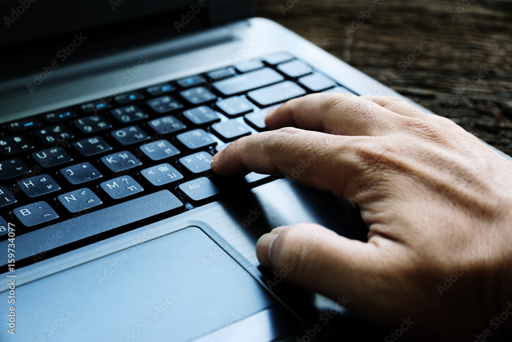 hand on keyboard close up at home office working hand on keyboard close up at home office working