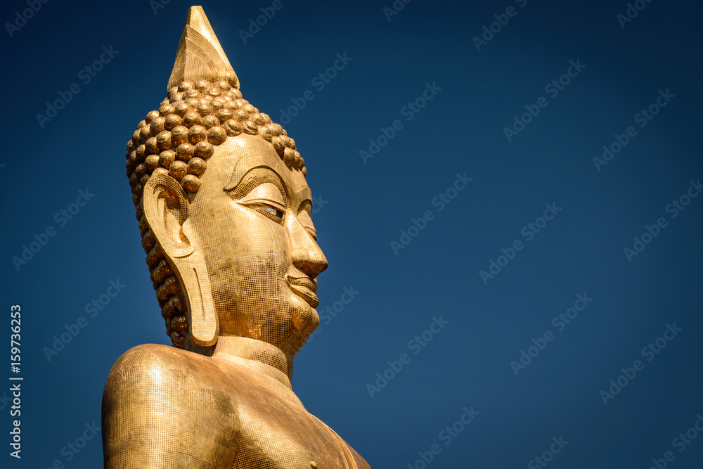 Golden Buddha statue in Buddhist  temple or wat, is public domain or treasure of Buddhism. (Shot at outdoor ,public area)