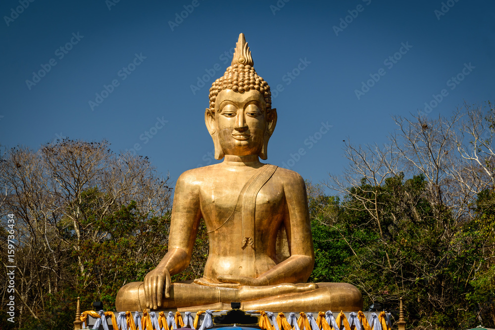Golden Buddha statue in Buddhist  temple or wat, is public domain or treasure of Buddhism. (Shot at outdoor ,public area)