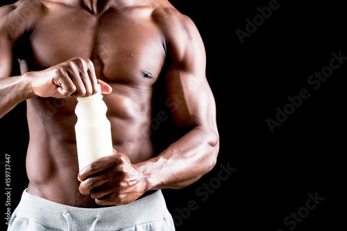 man big muscles with milk bottle