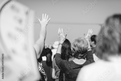 Christian praying with raised hand worship.