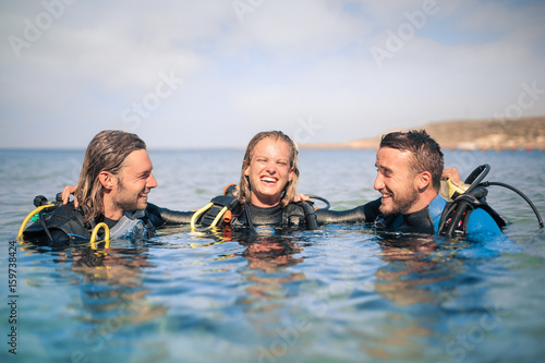Scuba divers enjoying their excursion in the sea