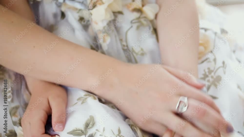 mother and daughter sitting in front of a big window