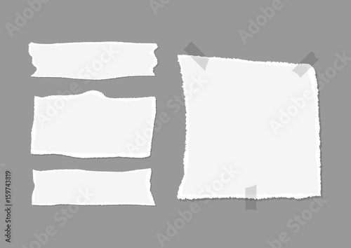 Set of pieces of torn paper with shadow and adhesive tape. Isolated on a dark gray background.