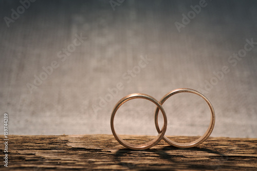 wedding rings on wood