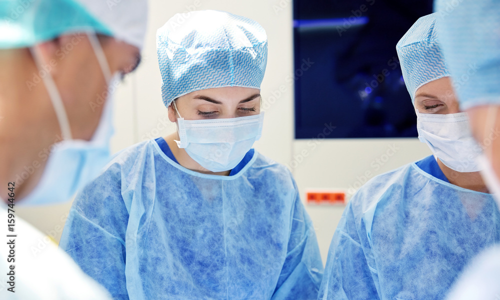 group of surgeons in operating room at hospital group of surgeons in operating room at hospital