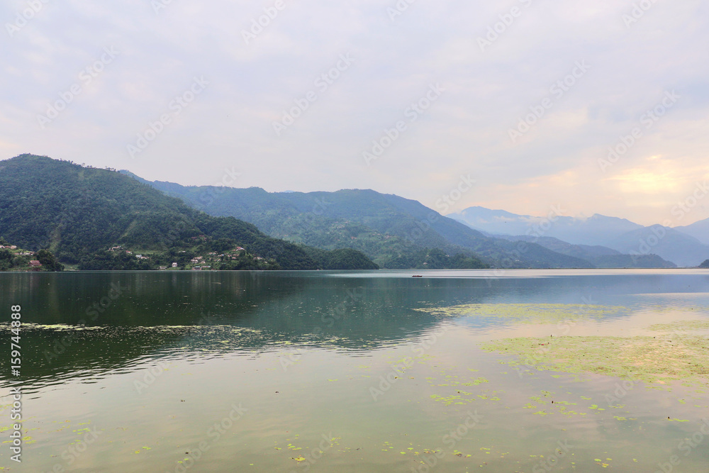Phewa Lake in Pokhara, second largest freshwater lake in Nepal, famous for the reflection of Machhapuchhre & other mountain peaks on its surface. Phewa Lake in Pokhara, second largest freshwater lake in Nepal, famous for the reflection of Machhapuchhre & other mountain peaks on its surface.