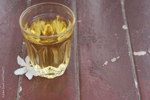 Hot tea in glass on the wooden.