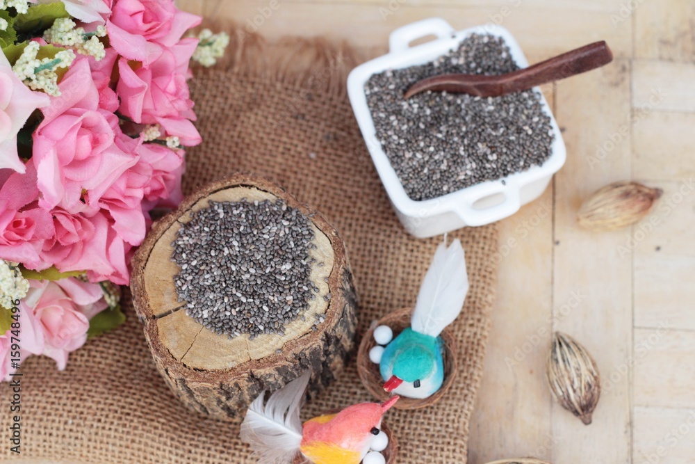 Chia seeds for health on wood background. Chia seeds for health on wood background.