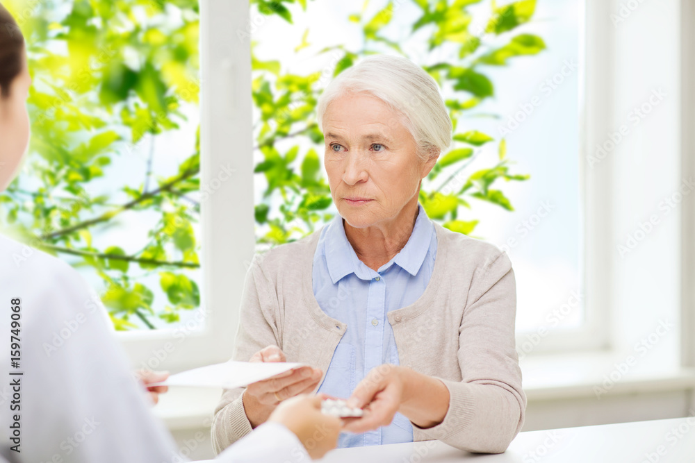 doctor giving prescription and drug to woman doctor giving prescription and drug to woman