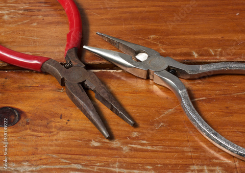 Two Pliers on the Wood Table