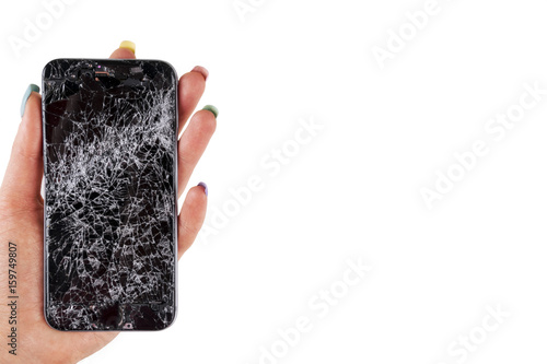 Woman hand holding modern mobile smartphone broken screen and damages. Cellphone crashed and scratch. Device destroyed. Smash gadget, need repair. white background photo