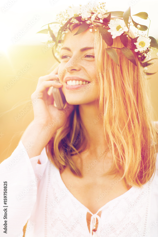 Fototapeta premium happy young woman calling on smartphone at country