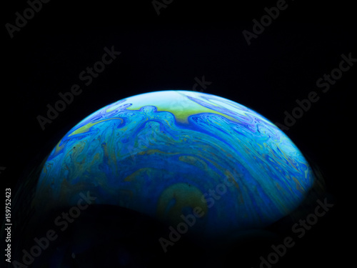 Reflection of soap bubble with black background