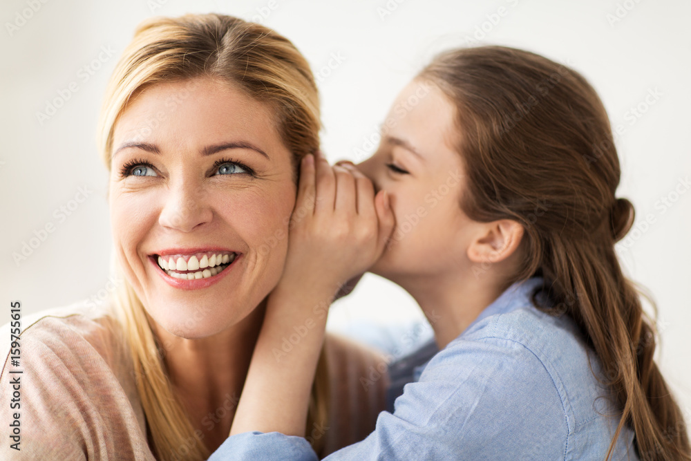 happy girl whispering secret to her mother happy girl whispering secret to her mother