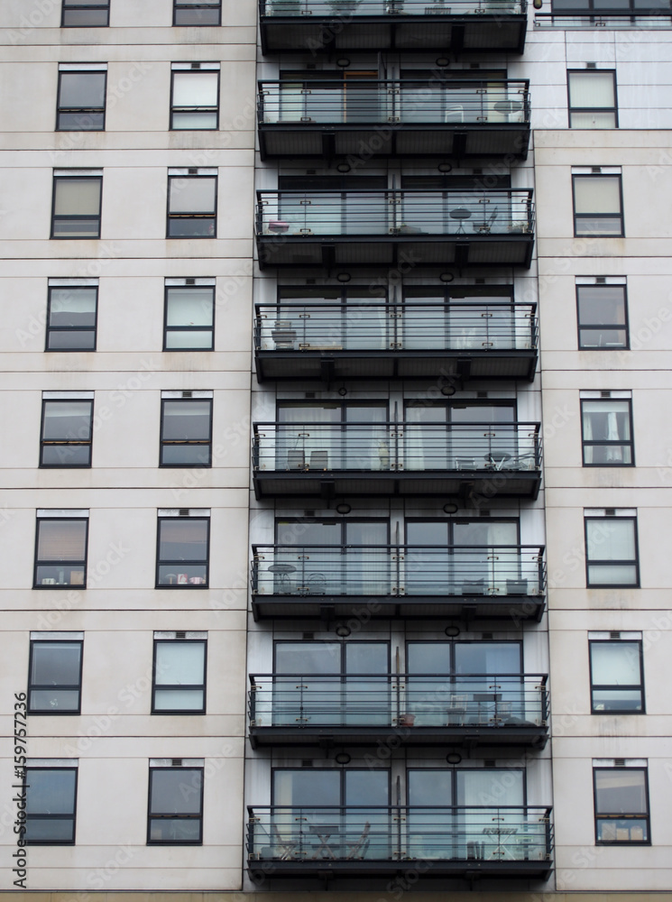 Fototapeta premium Modern residential nuilding with white cladding and balconies