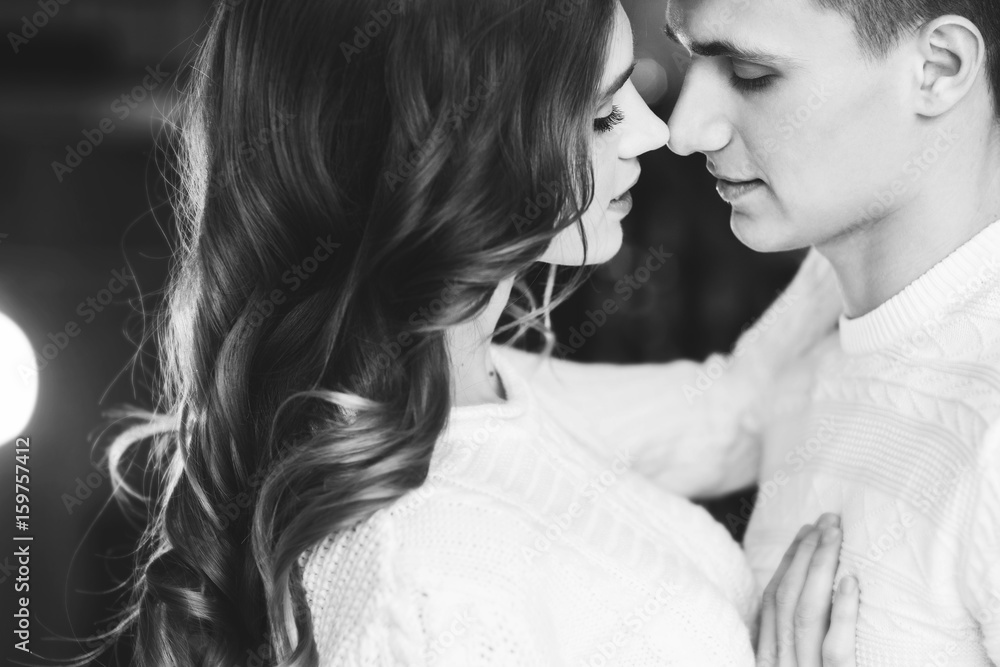 Naklejka premium Young couple in love, closeup. Black and white image