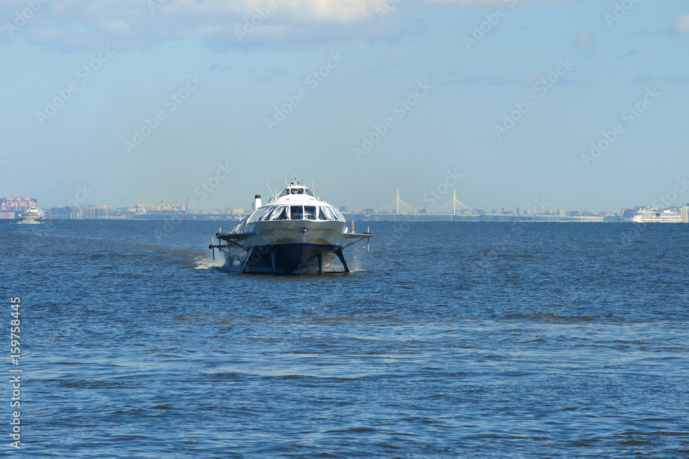 The hydrofoil boat travels along the Gulf of Finland on a sunny May day, Saint-Petersburg