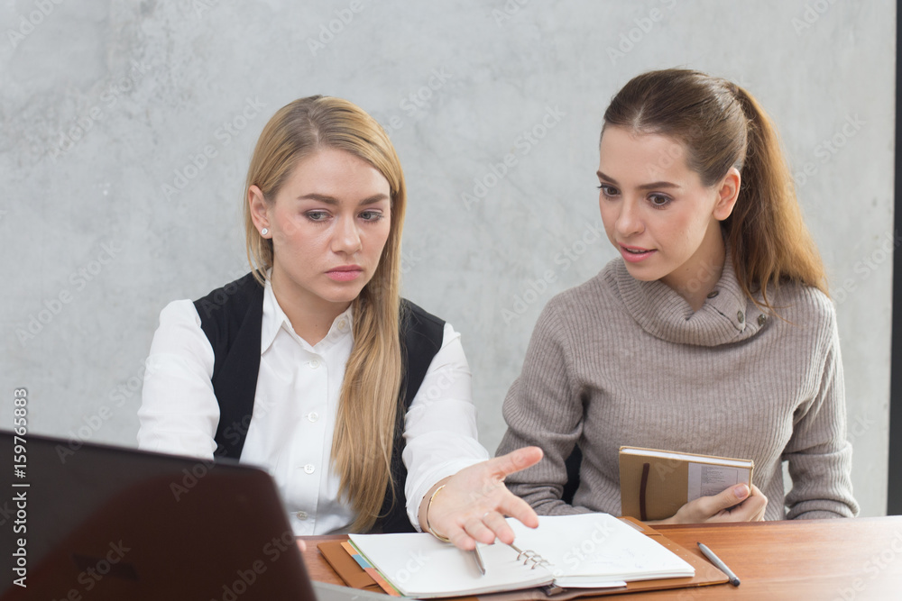 Young woman working together in modern place, Business people takling in modern office. problem for business concept, unhappy emotion Young woman working together in modern place, Business people takling in modern office. problem for business concept, unhappy emotion