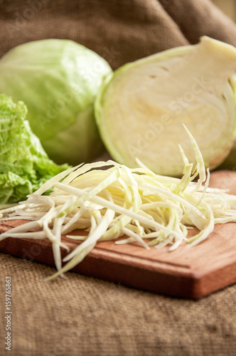 cabbage on a wooden board on a background sacking, burlap