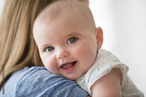 Portrait of baby girl with mother photo