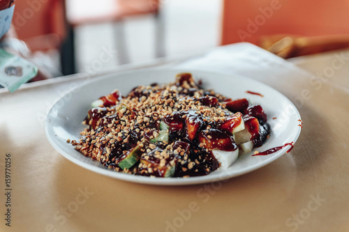 Rojak is a traditional fruit and vegetable salad dish commonly found in Indonesia, Malaysia and Singapore. Other than referring to this fruit salad dish. photo