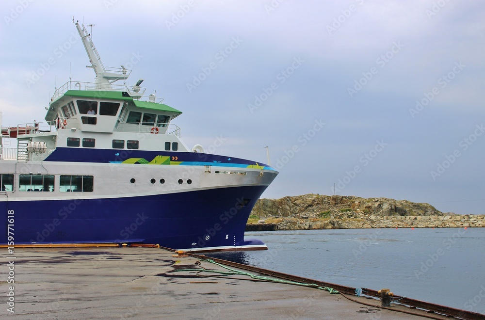 Naklejka premium A car has arrived in the northern port of the small island Utsira, Norway. The distance to the mainland, the town Haugesund, is about 18 km. Scandinavia, Europe.
