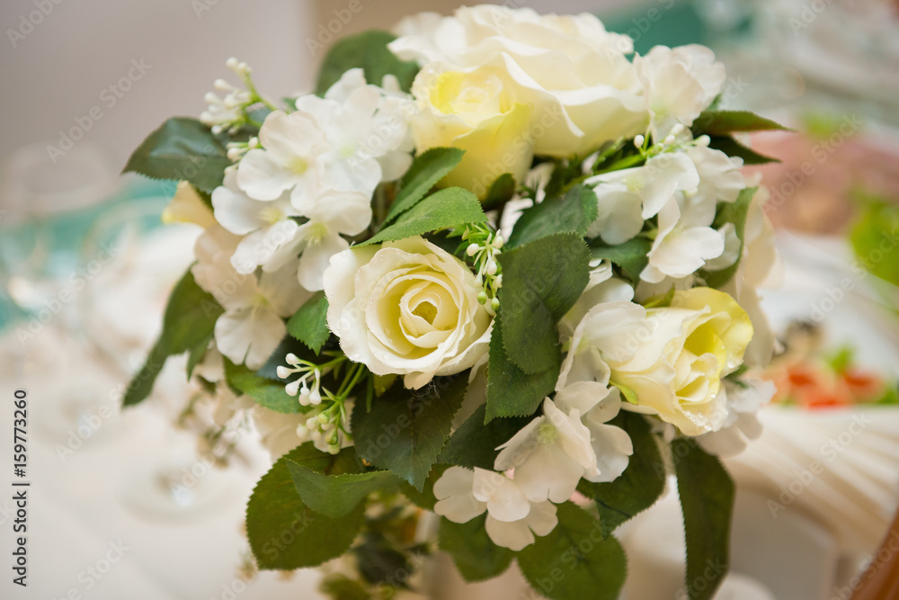 a bouquet of white roses on the table a bouquet of white roses on the table