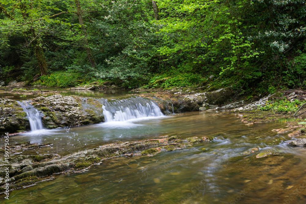 Mountain river with small waterfall Mountain river with small waterfall