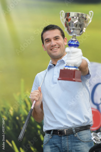 golfer winner with trophy photo