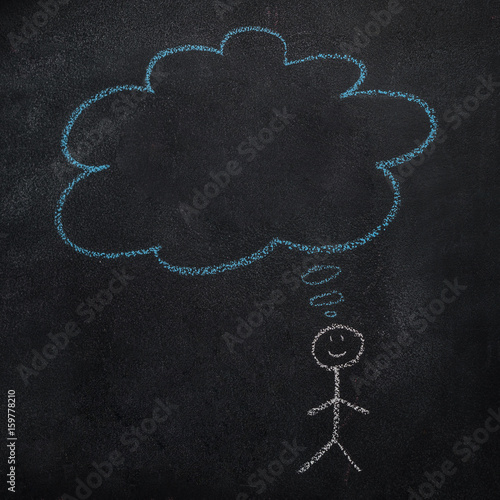Symbol of human with empty blue cloud, speech bubble drawn with chalk on blackboard