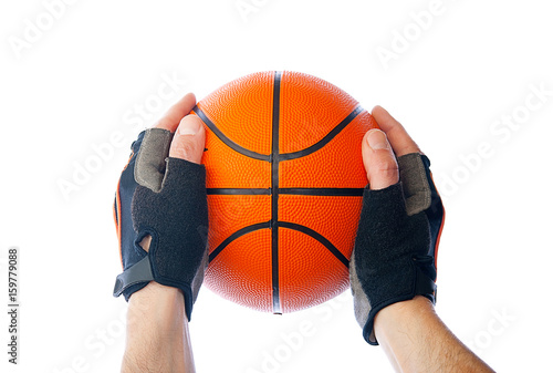 Basketball in hand on isolated background