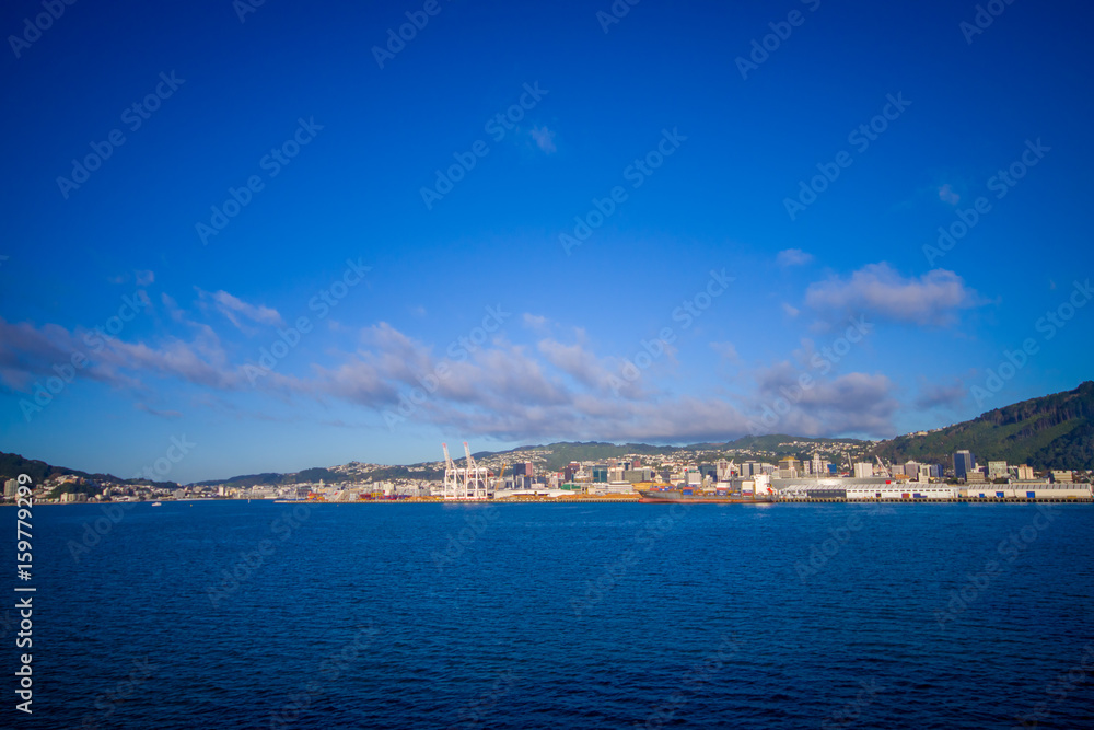 Beautiful view of the city in the horizont from ferry between north and south island in New Zealand, sailing into Picton