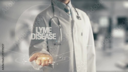 Doctor holding in hand Lyme Disease photo