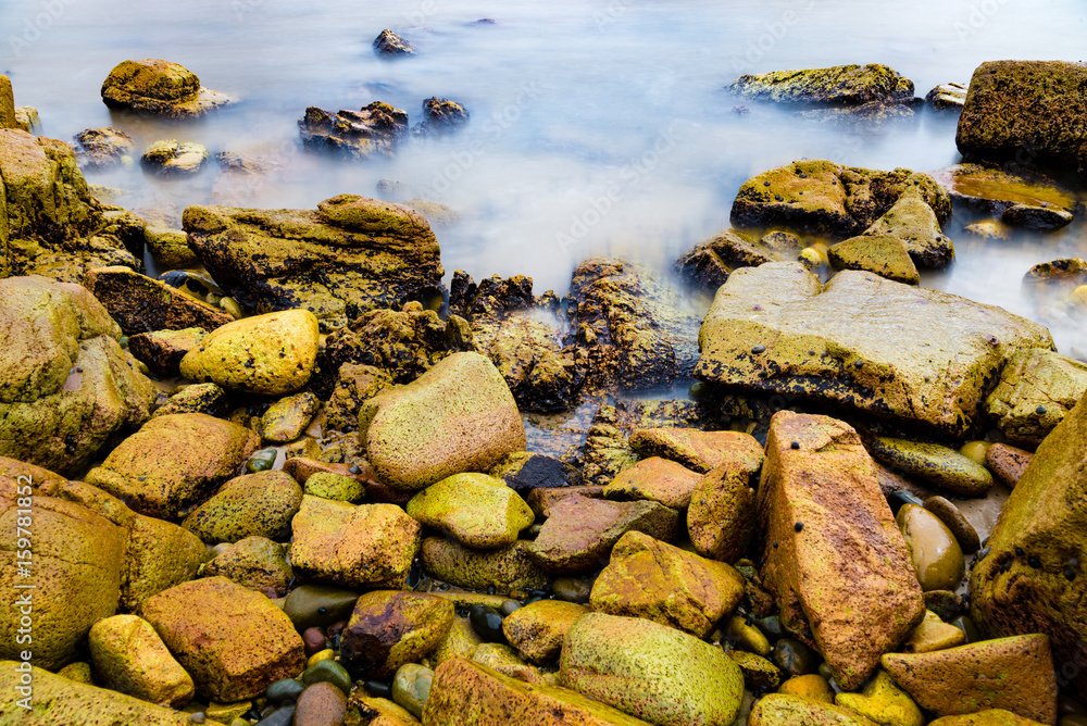 Colourful rocks and water at Diamond Head coast, Australia Colourful rocks and water at Diamond Head coast, Australia