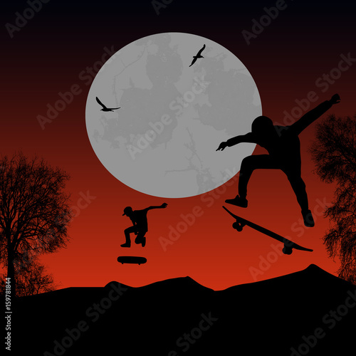 Skater silhouettes on park at beautiful sunset