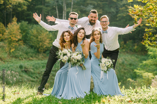 Friends of the newlyweds have a good time at the wedding. Stylish Guests communicate, have fun and laugh