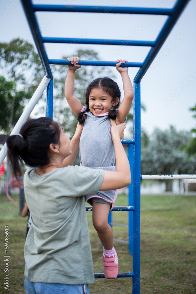 Little girl playing at the playground Little girl playing at the playground