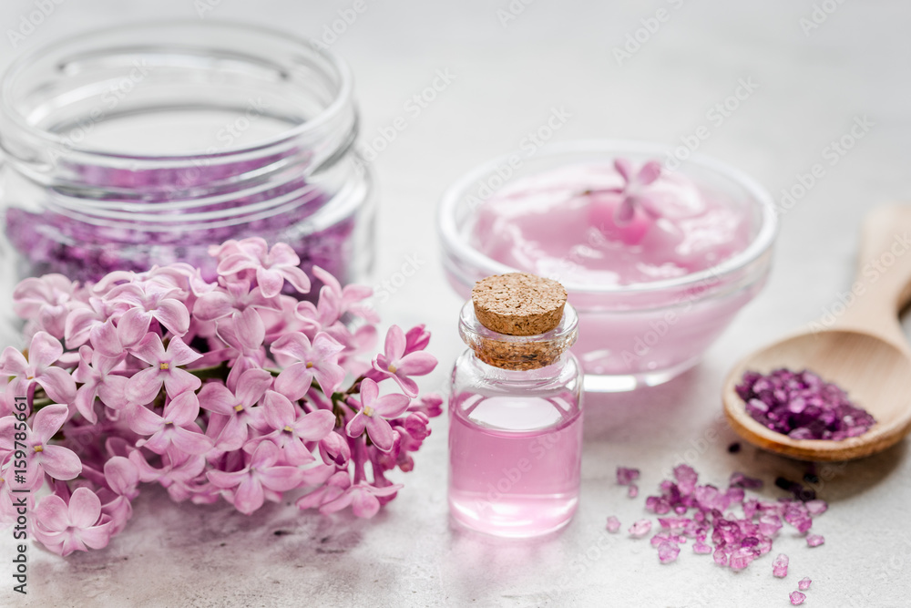 lilac natural cosmetic set for spa with salt stone table background lilac natural cosmetic set for spa with salt stone table background