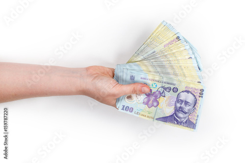 Woman's hand holding money isolated on white background. Romanian banknotes 100 RON.