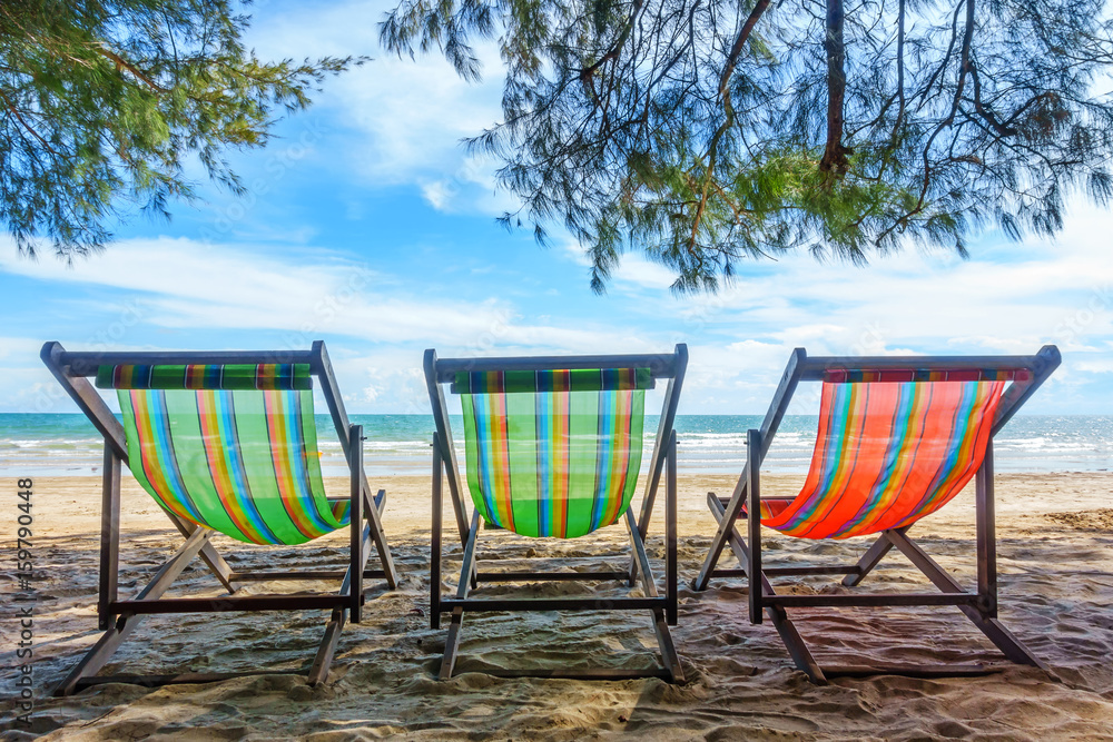 Bench chairs and white sand in summer time, Summer holiday and vacation concepts Bench chairs and white sand in summer time, Summer holiday and vacation concepts