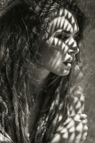 young beautiful woman with shadows on face © zolotareva_elina