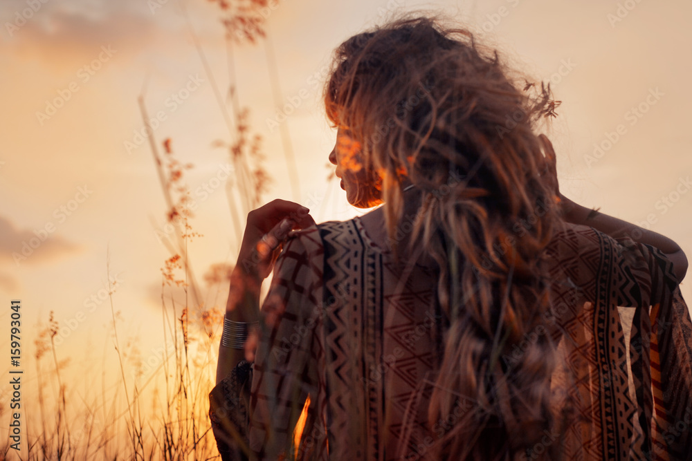 Fototapeta premium close up of beautiful young woman at sunset