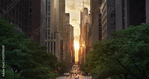 A cinematic wide evening establishing shot over 42nd Street in New York City during a 