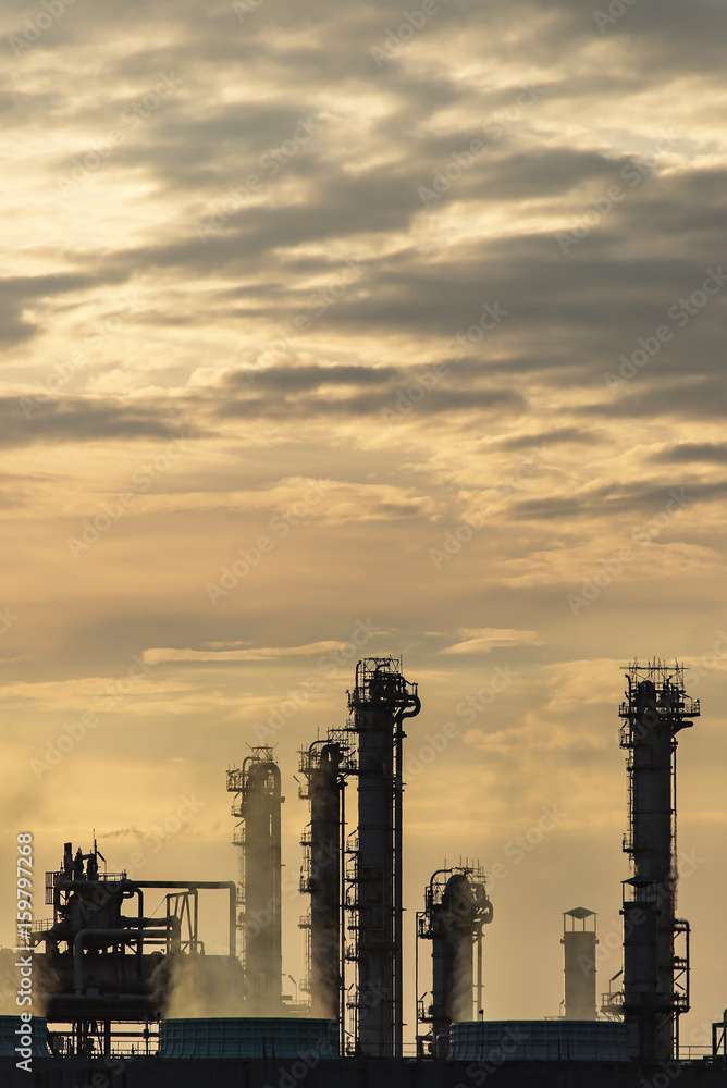 Oil refinery industry at sunset - factory - petrochemical plant