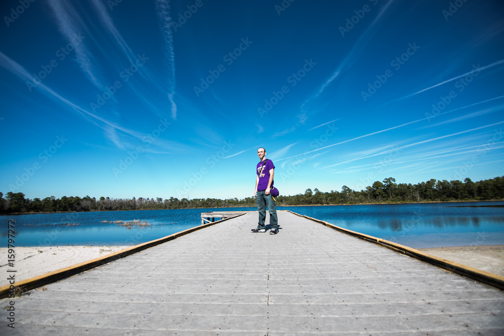 Portrait of smiling young man on a lake Portrait of smiling young man on a lake