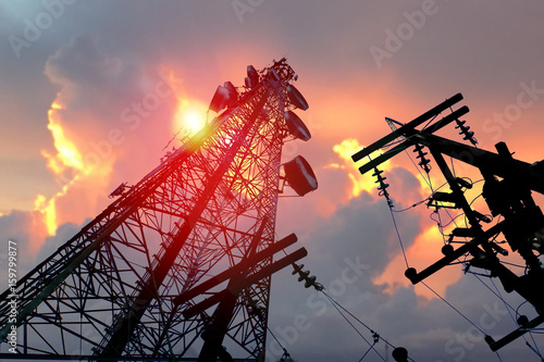 The antennas with blurry red sky.