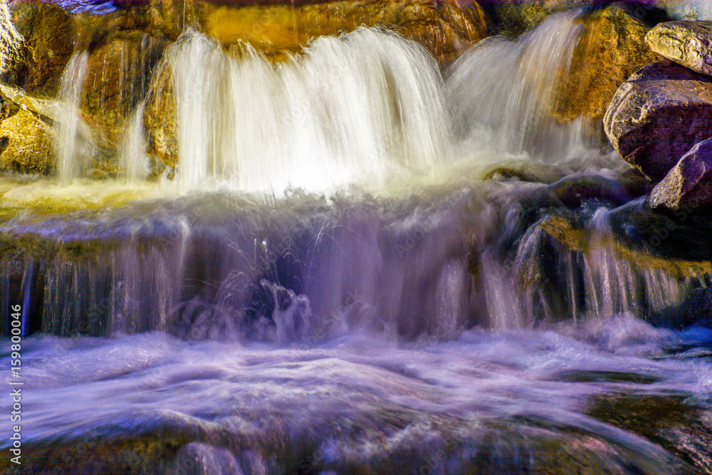 Fototapeta premium Waterfall with light in the night